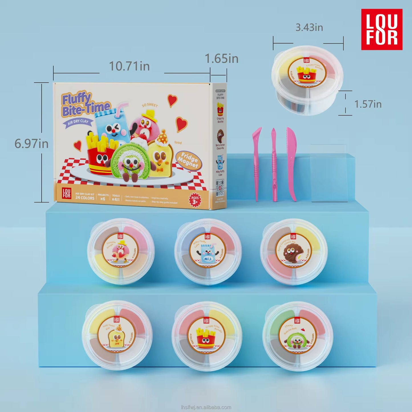 LOU FOR Fluffy Bite-time toy set displayed on a light blue tiered stand, showing the illustrated product box, six round bite-time containers, three pink plastic tools, and dimension callouts on a pale blue background.